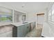 Kitchen island with seating and modern finishes, perfect for cooking and entertaining at 5521 Makoma Dr, Orlando, FL 32839