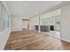 Open concept living space with hardwood flooring and ample natural light, ideal for modern living at 5521 Makoma Dr, Orlando, FL 32839