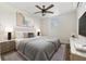 Stylishly furnished main bedroom with a ceiling fan, art, and good natural light at 5521 Makoma Dr, Orlando, FL 32839