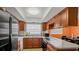 Functional kitchen equipped with stainless steel appliances and ample counter space for cooking at 5891 Sir Henry Rd, Orlando, FL 32808
