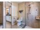 Well lit bathroom includes a glass shower, toilet, vanity, and updated fixtures at 6226 Wynfield Court, Orlando, FL 32819