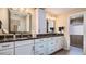 Bright bathroom features double sinks, granite countertops, white cabinets, and walk-in shower at 6226 Wynfield Court, Orlando, FL 32819