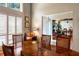 Elegant dining area featuring hardwood floors, plantation shutters, and stylish furnishings at 6226 Wynfield Court, Orlando, FL 32819