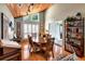 Bright dining room featuring a wood-paneled ceiling, hardwood floors, and ample natural light at 6226 Wynfield Court, Orlando, FL 32819