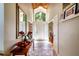 Elegant foyer with a high ceiling, chandelier, tiled floor, and a view of the front door at 6226 Wynfield Court, Orlando, FL 32819