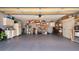 Spacious garage with ample storage cabinets, shelving units, and room for multiple vehicles at 6226 Wynfield Court, Orlando, FL 32819