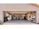 A spacious, well-lit garage provides plenty of storage with built-in cabinets and shelving units at 6226 Wynfield Court, Orlando, FL 32819