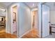 Hallway features hardwood flooring, access to multiple bedrooms and bathrooms at 6226 Wynfield Court, Orlando, FL 32819