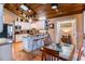 Eat-in kitchen with granite countertops, barstool seating, and stainless steel appliances at 6226 Wynfield Court, Orlando, FL 32819