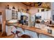 Charming kitchen with breakfast bar, granite counters, white cabinets, and stainless appliances at 6226 Wynfield Court, Orlando, FL 32819