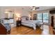 Serene main bedroom featuring hardwood floors and an ensuite bathroom at 6226 Wynfield Court, Orlando, FL 32819