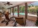 This home has a screened in patio featuring stone pillars and views of the pool and nearby patio seating at 6226 Wynfield Court, Orlando, FL 32819