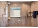 Spacious tiled shower offers shelving, mounted shower head and detachable shower head at 6226 Wynfield Court, Orlando, FL 32819