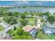 Aerial shot displays a home with a screened-in pool, landscaped yard, and proximity to a lake at 6630 Hidden Beach Cir, Orlando, FL 32819