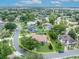 Expansive aerial view of a single-Gathering home, highlighting mature landscaping, fenced pool, and neighborhood streets at 6630 Hidden Beach Cir, Orlando, FL 32819