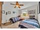 Cozy bedroom with two twin beds, ceiling fan, and natural light at 6630 Hidden Beach Cir, Orlando, FL 32819