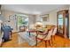 Inviting living room with hardwood floors, stylish furnishings, and a large window showcasing the outdoor scenery at 6630 Hidden Beach Cir, Orlando, FL 32819