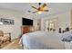 Comfortable main bedroom with tile floors, ample closet space, and a sliding glass door to the outdoor patio at 6630 Hidden Beach Cir, Orlando, FL 32819