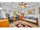 Spacious home office with vaulted ceiling, ceiling fan, and large window views at 6630 Hidden Beach Cir, Orlando, FL 32819