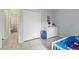 Bright bedroom featuring a bed, dresser and closet at 705 Ibis Ave, Deltona, FL 32738