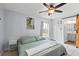 This bedroom has tiled floors, an ensuite bath, and plenty of natural light at 705 Ibis Ave, Deltona, FL 32738