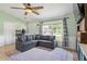 Cozy living room with a large window and comfortable seating at 705 Ibis Ave, Deltona, FL 32738