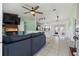 Open-concept living room with a fireplace and easy access to the kitchen and dining area at 705 Ibis Ave, Deltona, FL 32738