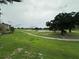 Scenic view of a well-maintained golf course with lush green grass and mature trees, perfect for golf enthusiasts at 7230 Westpointe Blvd # 1235, Orlando, FL 32835