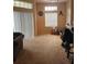 Open living room with patio access and neutral decor at 7230 Westpointe Blvd # 1235, Orlando, FL 32835