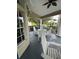 A covered patio with ample seating and a view of the lush green surroundings at 7230 Westpointe Blvd # 1235, Orlando, FL 32835