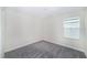 This bedroom features neutral walls and carpeting and a window with blinds at 7530 Summerlake Groves St, Winter Garden, FL 34787