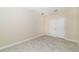 A well-lit secondary bedroom features tile flooring, base molding, and a closet at 7530 Summerlake Groves St, Winter Garden, FL 34787