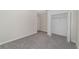 This bedroom features neutral walls, carpeting, and a closet at 7530 Summerlake Groves St, Winter Garden, FL 34787