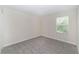This bedroom features neutral walls and carpeting and a window with blinds at 7530 Summerlake Groves St, Winter Garden, FL 34787