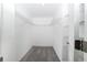 Spacious walk-in closet with ample shelving and plush gray carpet at 7530 Summerlake Groves St, Winter Garden, FL 34787