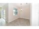 This dining room features tile flooring and a chandelier at 7530 Summerlake Groves St, Winter Garden, FL 34787