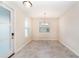 Bright, minimalist dining room with tile flooring and lots of natural light from multiple windows at 7530 Summerlake Groves St, Winter Garden, FL 34787