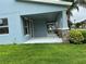 Inviting covered porch area with stone accents and manicured landscaping at 7530 Summerlake Groves St, Winter Garden, FL 34787
