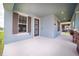 Charming home exterior with a covered entryway and stone-accented columns at 7530 Summerlake Groves St, Winter Garden, FL 34787