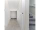 View of tiled hallway and stairs with carpet at 7530 Summerlake Groves St, Winter Garden, FL 34787