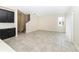 Open-concept living room with large windows, tile flooring and an adjacent kitchen space at 7530 Summerlake Groves St, Winter Garden, FL 34787