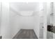 An organized walk-in closet featuring sturdy wire shelving and neutral carpet at 7530 Summerlake Groves St, Winter Garden, FL 34787