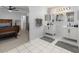 Bathroom featuring dual sinks, stylish hardware, modern lighting, and neutral tones at 7764 Indian Ridge N Trl, Kissimmee, FL 34747