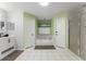 Bright bathroom featuring a tub and shower, separate doors, and neutral tones at 7764 Indian Ridge N Trl, Kissimmee, FL 34747