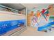 Marvel themed bedroom with bunk beds and a slide for added fun at 7764 Indian Ridge N Trl, Kissimmee, FL 34747