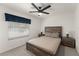 Bedroom with neutral tones and an inviting bed and ceiling fan with light at 7764 Indian Ridge N Trl, Kissimmee, FL 34747