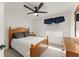 Comfortable bedroom with natural light, ceiling fan and a spacious closet at 7764 Indian Ridge N Trl, Kissimmee, FL 34747