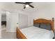 Bright bedroom featuring a bed with gray pillows and a spacious closet at 7764 Indian Ridge N Trl, Kissimmee, FL 34747