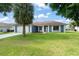 Inviting single story home with a well manicured lawn and a two car garage at 7764 Indian Ridge N Trl, Kissimmee, FL 34747