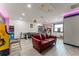 Spacious game room featuring a comfortable sofa, and various arcade-style games at 7764 Indian Ridge N Trl, Kissimmee, FL 34747